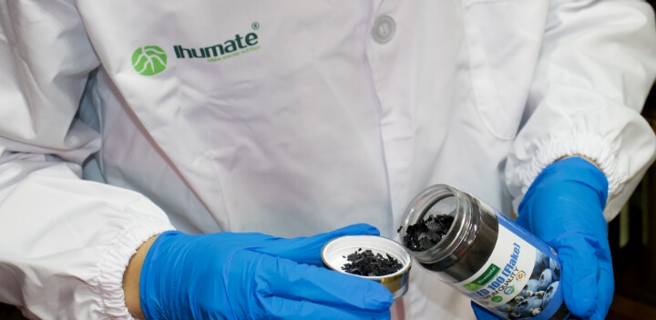 Ihumate R&D staff performing product quality inspection.