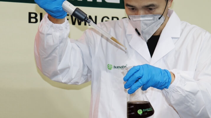 Ihumate R&D staff performing quality checks for solubility and quality.