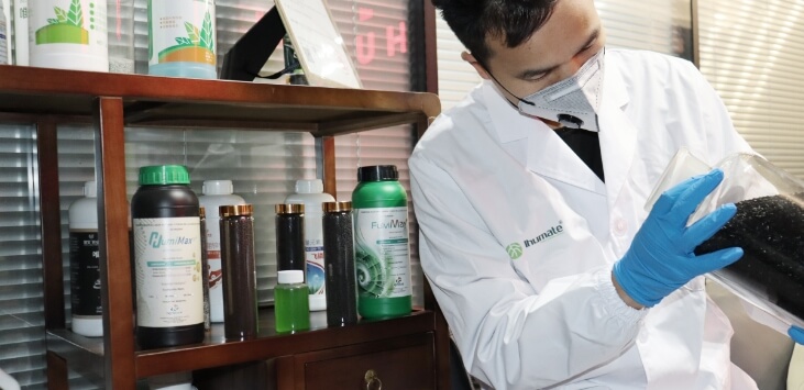 Ihumate QC experts analyzing raw material purity to ensure high quality.